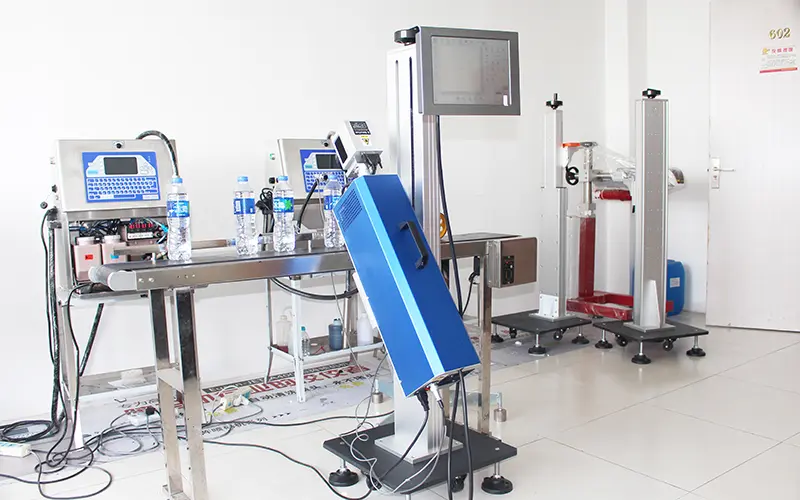 Automatic laser printer for date coding on water bottles