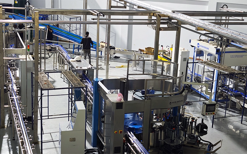 Technical team from NAVAN Africa CO.,LTD inspecting a beverage filling line at a manufacturing facility in Africa.