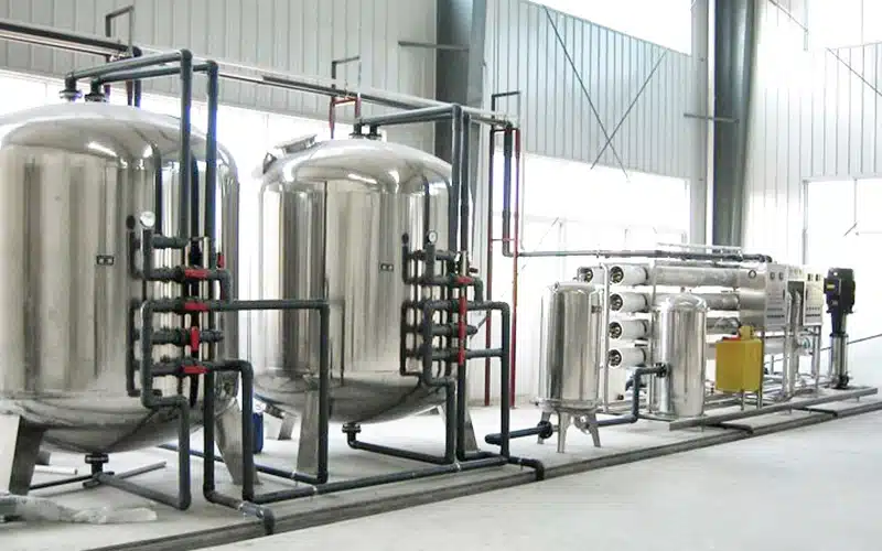 Reverse Osmosis water purification system used in bottled water production, featuring multiple filter vessels.