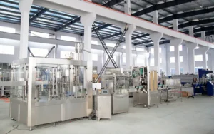 Complete water bottling plant equipment showing water tanks, filling machine, labeler, and packer in sequence