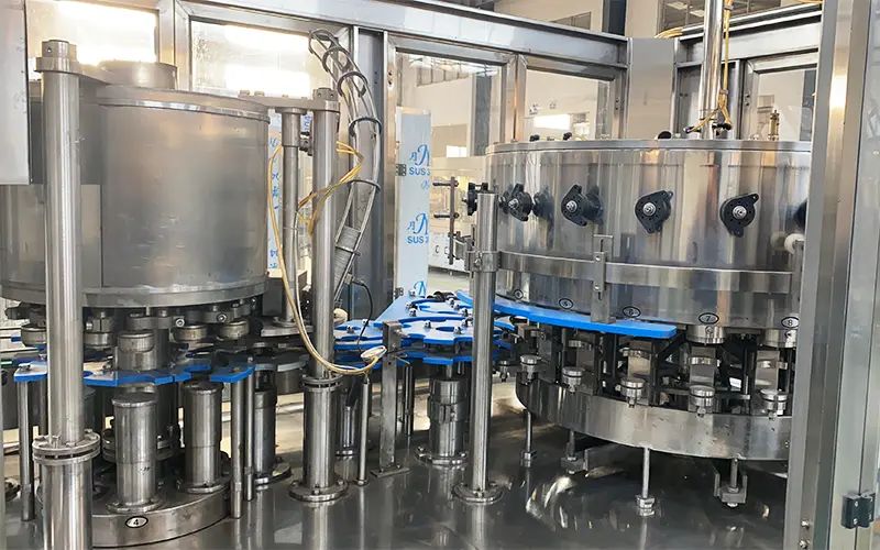 18 filling valves and 4 sealing heads on a rotary can filler seamer